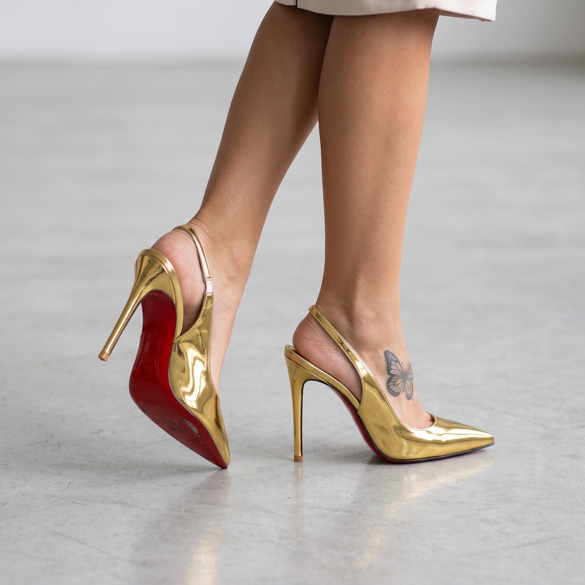Christian Louboutin Slingback β Gold Patent π