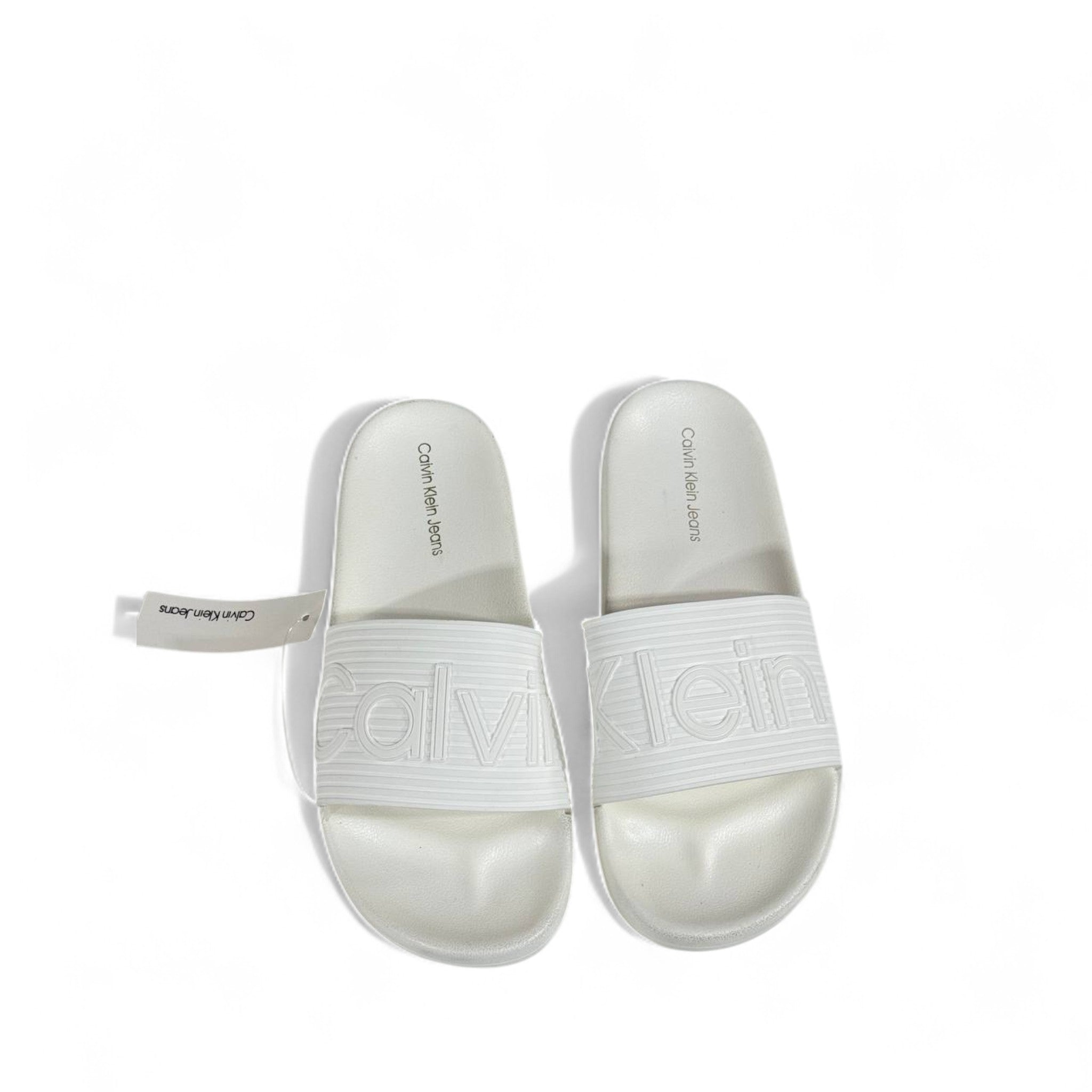 🤍 Calvin Klein All-White Slides – Embossed Logo Luxe Slippers