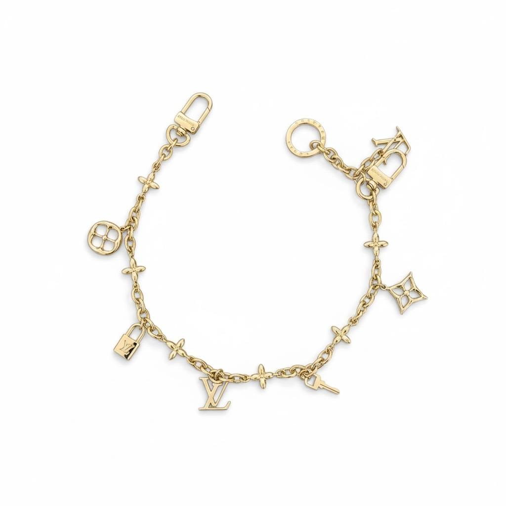 Louis Vuitton Gold Bag Charm β Iconic LV Monogram Accessory β¨π