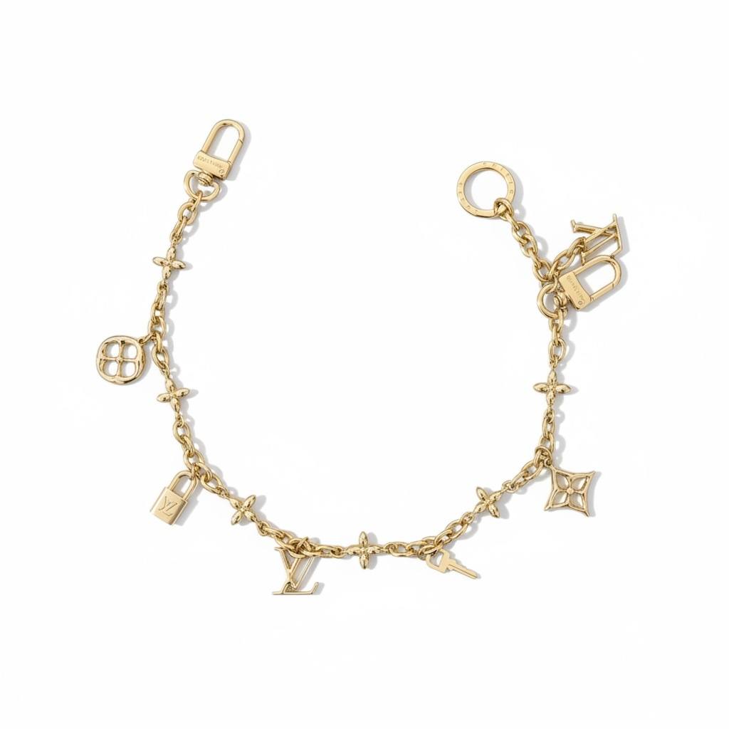 Louis Vuitton Gold Bag Charm β Iconic LV Monogram Accessory β¨π