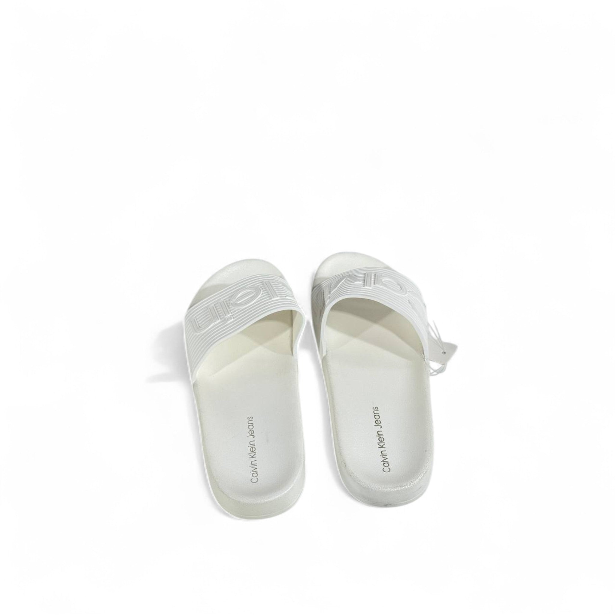 🤍 Calvin Klein All-White Slides – Embossed Logo Luxe Slippers
