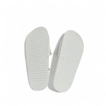 🤍 Calvin Klein All-White Slides – Embossed Logo Luxe Slippers