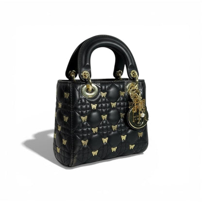 👜 Dior Black Quilted Mini Top-Handle Bag with Gold Butterfly Details 🖤✨