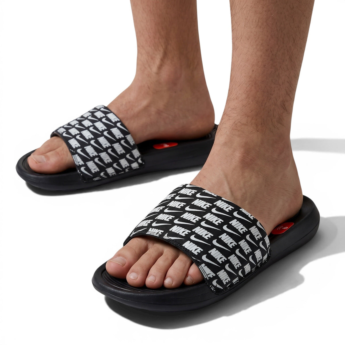 ⚫⚪ Nike All-Over Logo Slides – Streetwear Statement Edition