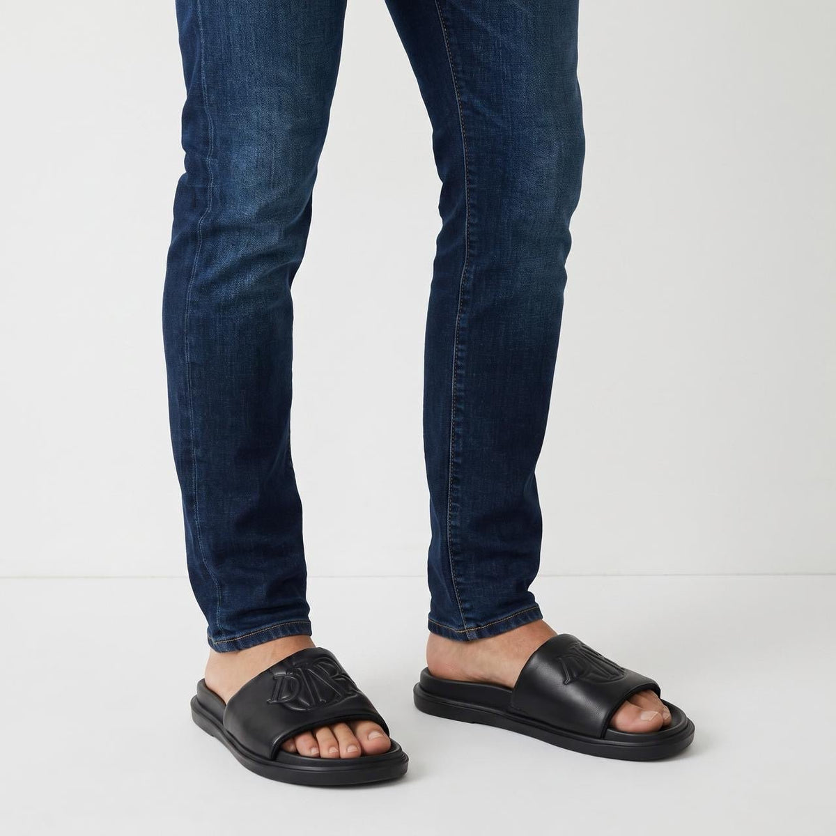 Dior Men's Embossed Logo Pool Slide — Black